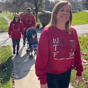 Kane Family Turkey Trot walking on the sidewalk